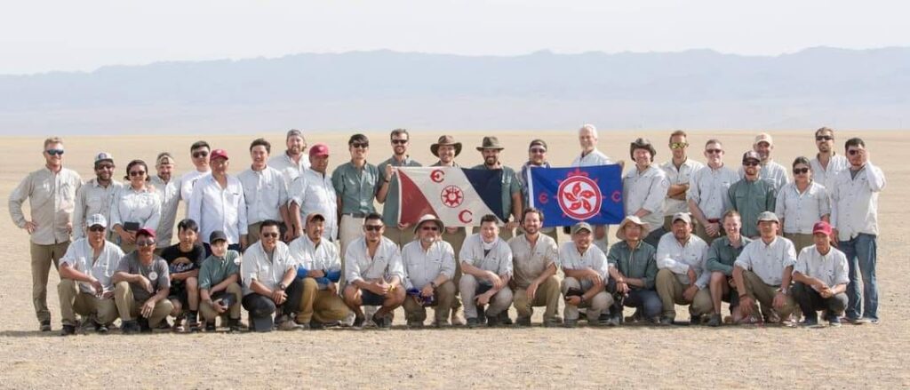 Bob Atwater, behind the blue flag, with members of the Explorers Club.